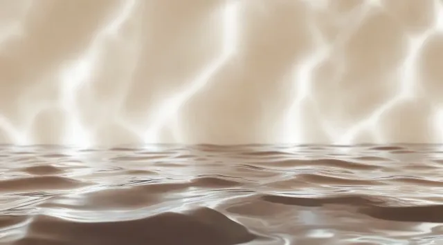 Beige water surface showing soft ripples and sunlight caustic patterns across the reflection.