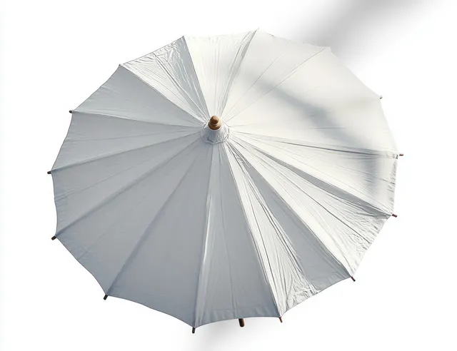 Top view of an open white outdoor umbrella showing fabric ribs and strong shadows on a bright background.