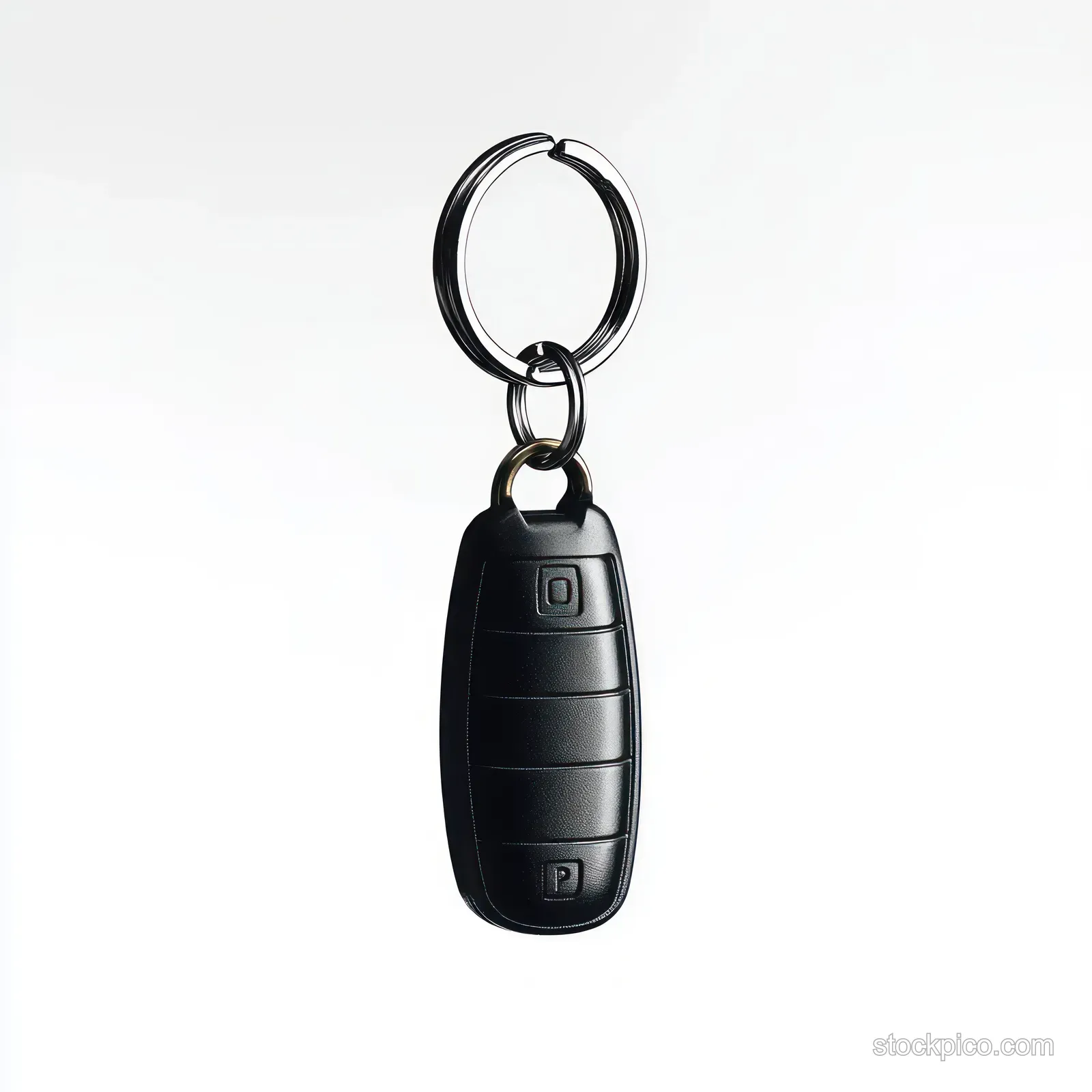 Black car key fob with metallic key ring keychain isolated on a clean white background.