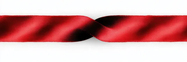 Red satin ribbon looped on white background with soft folds