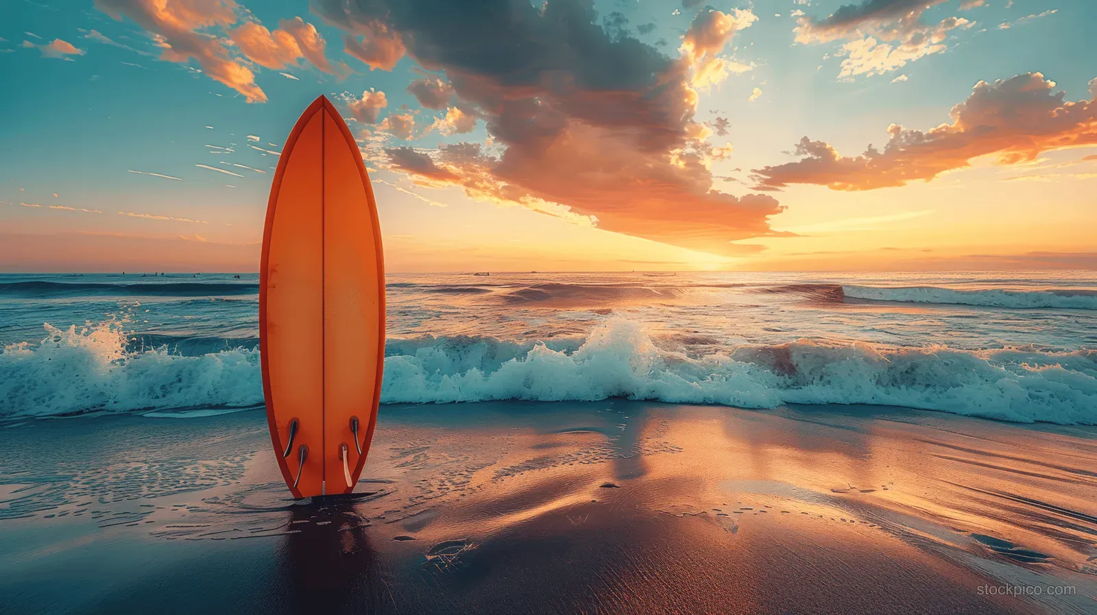 Vintage orange surfboard standing in wet sand as ocean waves break and a sunset sky glows.