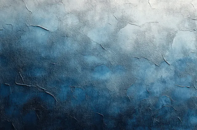 Close-up of a cracked textured wall with a blue gradient and peeling paint on weathered concrete.