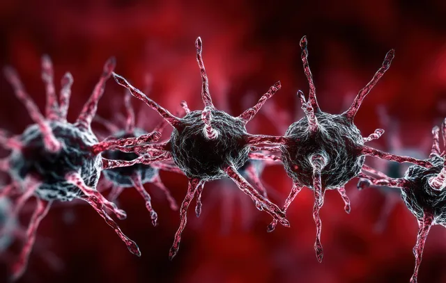 Spiky virus-like particles float in a deep red microscopic background.