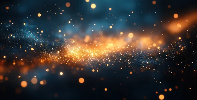 Glittering gold and teal bokeh sparkles forming a glowing light burst in dark background