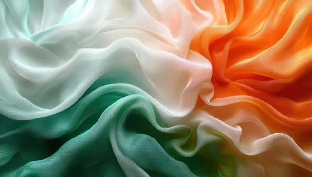 Flowing silk-like fabric waves in orange, white, and green with soft shadow folds
