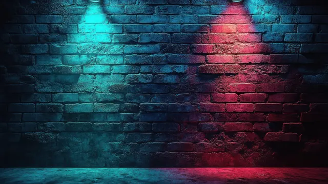 A dark exposed brick wall is lit by blue and red spotlights, casting colored shadows onto the floor.