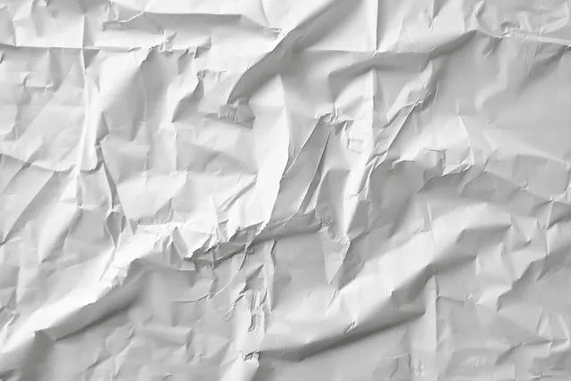 White Crumpled Paper Texture with Soft Shadows and Folded Creases with Abstract Background