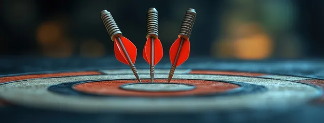 Red darts hitting a dartboard bullseye with natural light background blur