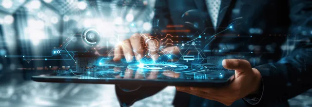 A professional engages with holographic AI visuals and digital gears in a modern business setting, showcasing advanced technology.