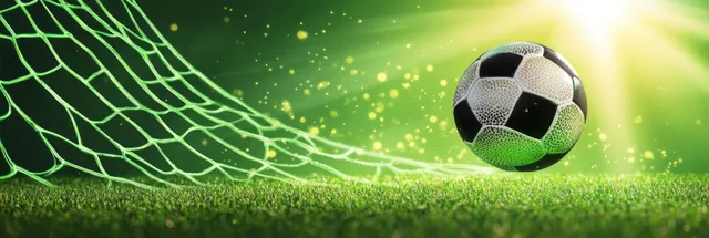 A black and white soccer ball strikes the net over bright green grass with glowing light particles.