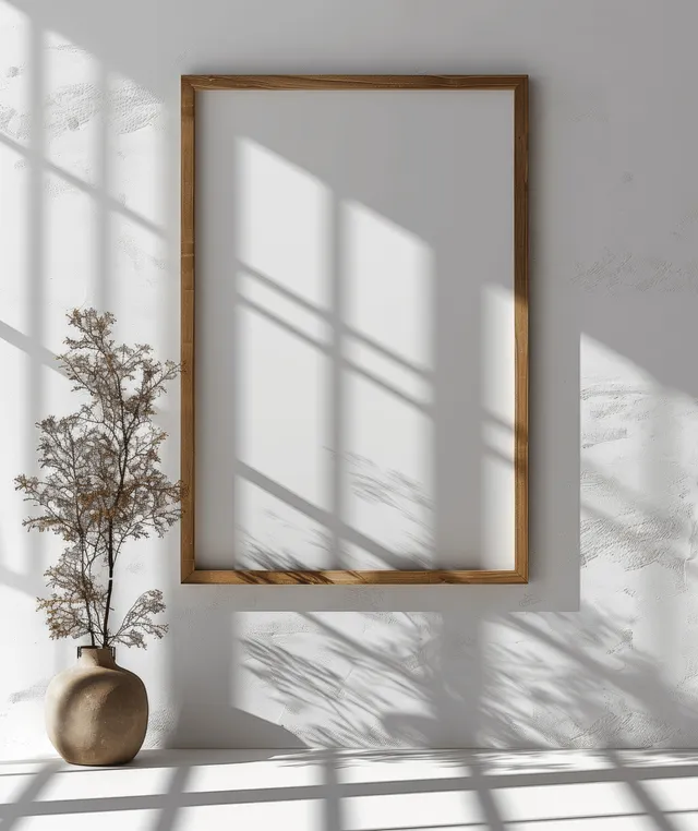 Vertical wooden picture frame mockup on white wall with window shadow and empty portrait mat