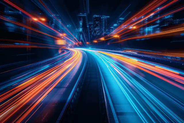Neon-lit night highway zooming forward with long-exposure car light trails through city skyline