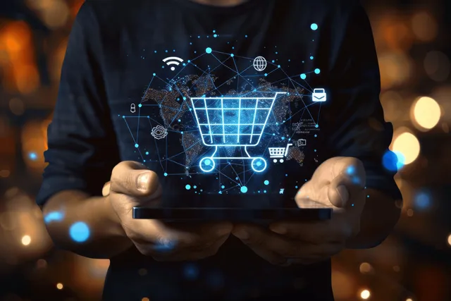 A person holds a smartphone while a glowing e-commerce cart and discount icons appear as a digital overlay.