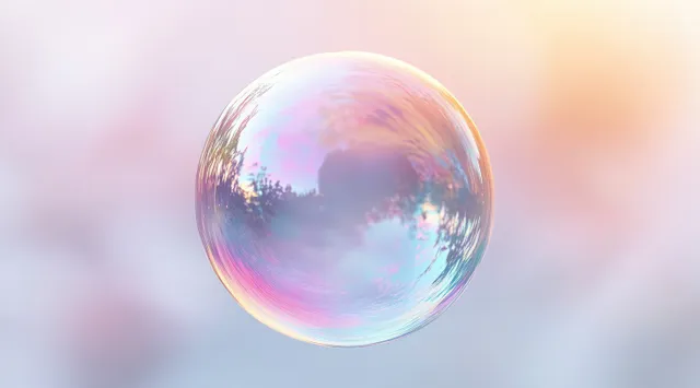Iridescent soap bubble floating in pastel bokeh, glowing rainbow reflections and soft haze
