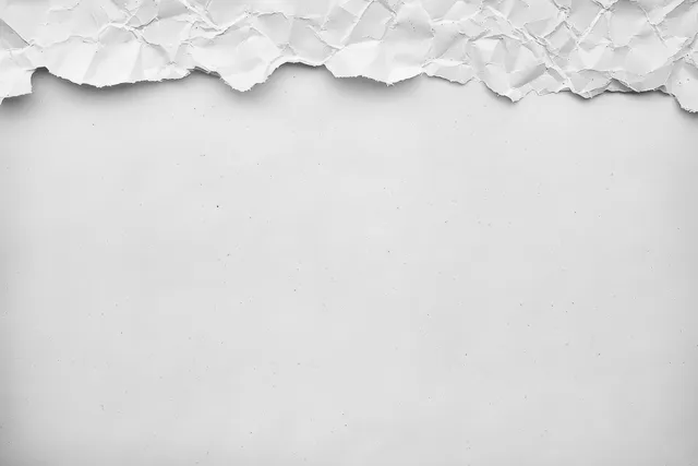 White torn craft paper background with crumpled edge, grunge marks, and faint old newspaper vignette.
