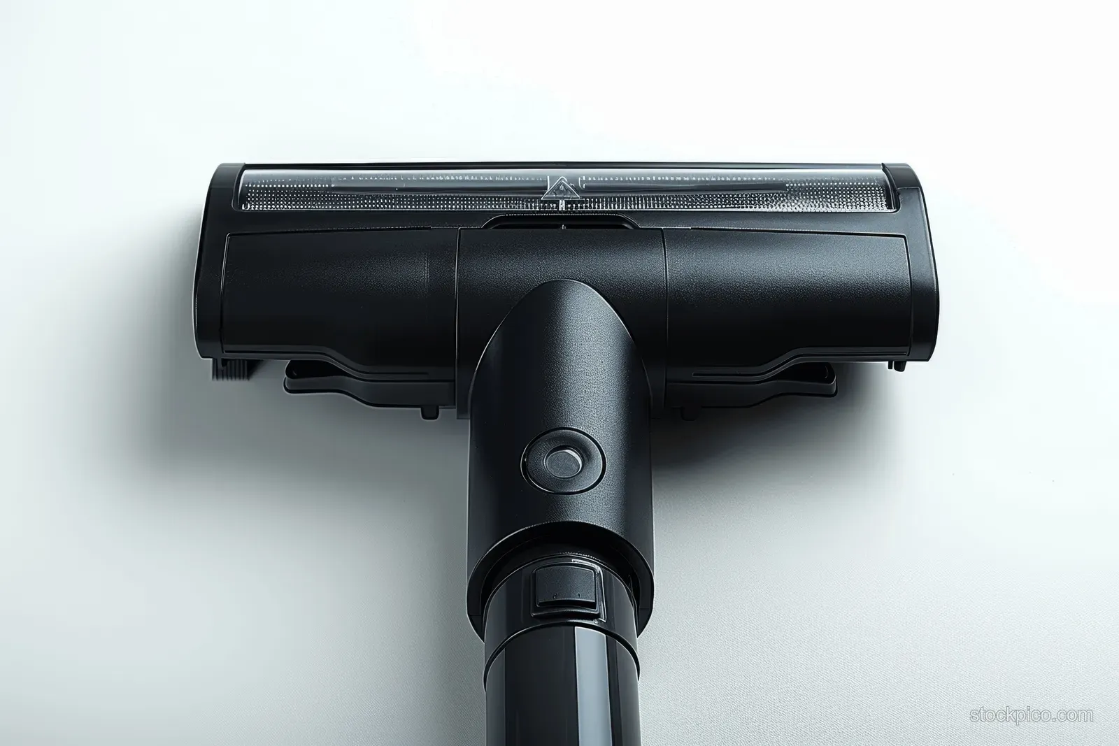 Black vacuum floor nozzle with open brush cover shown in close-up on a white background.