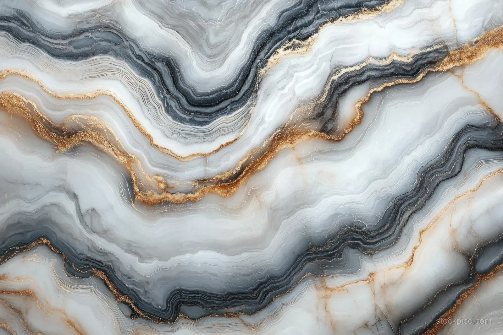 Close-up marble surface with layered flowing gray, white, and gold veining bands.