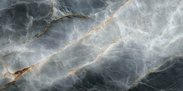 Close-up cracked grey stone surface with white veining and orange-brown fracture lines