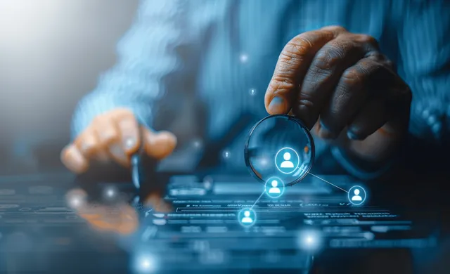 A gloved hand taps glowing person icons connected across a digital HR management interface.