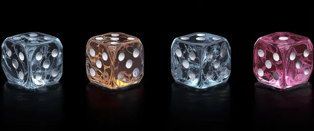Four colored glass dice arranged in a row on a dark background with soft reflective highlights.