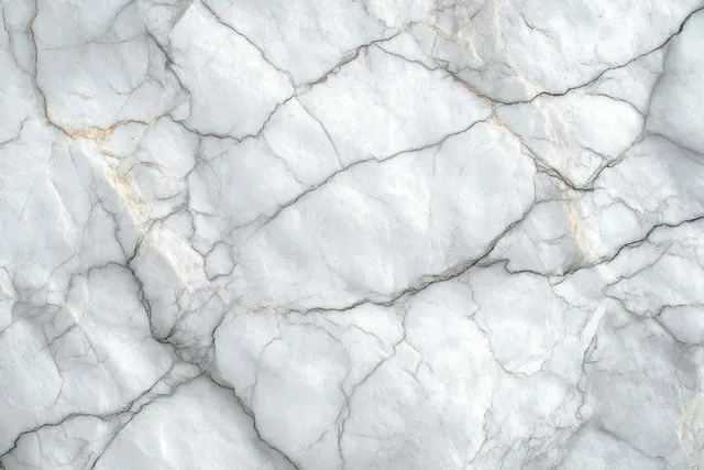 White marble surface close-up with gray cracks and faint golden veins forming a natural stone texture.