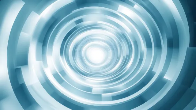 Concentric glowing rings in a blue futuristic tunnel recede into a bright white central light.