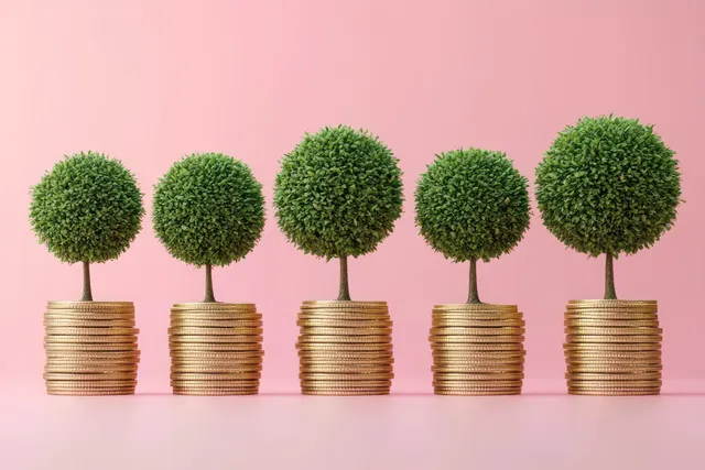 Five small green trees growing from stacks of golden coins on a pink background.