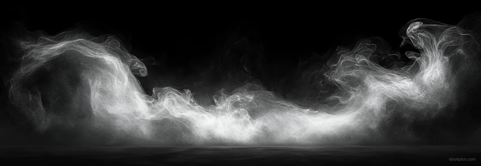 White smoke mist swirls into smooth plumes against a deep black background with visible wispy trails.