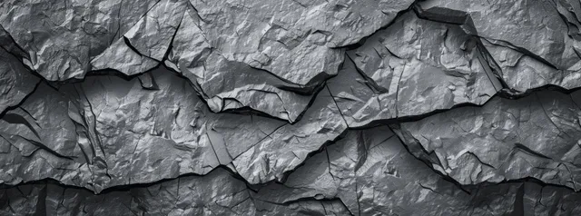 Weathered gray rock wall texture with cracked basalt slate slabs and rough grunge surface