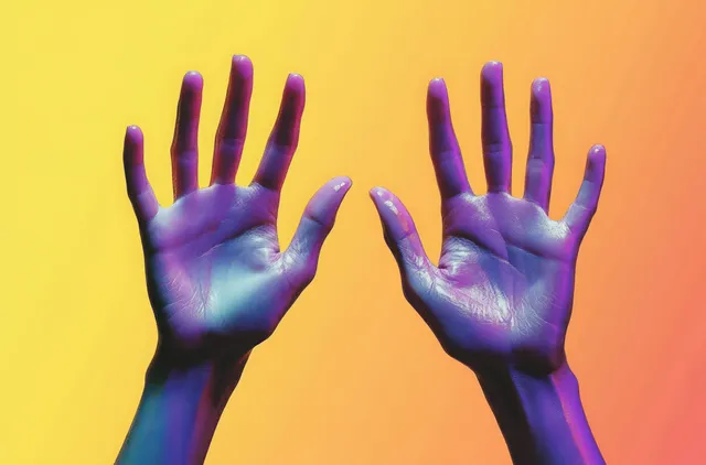 Two purple open palms with spread fingers are centered against a warm yellow to orange gradient background.