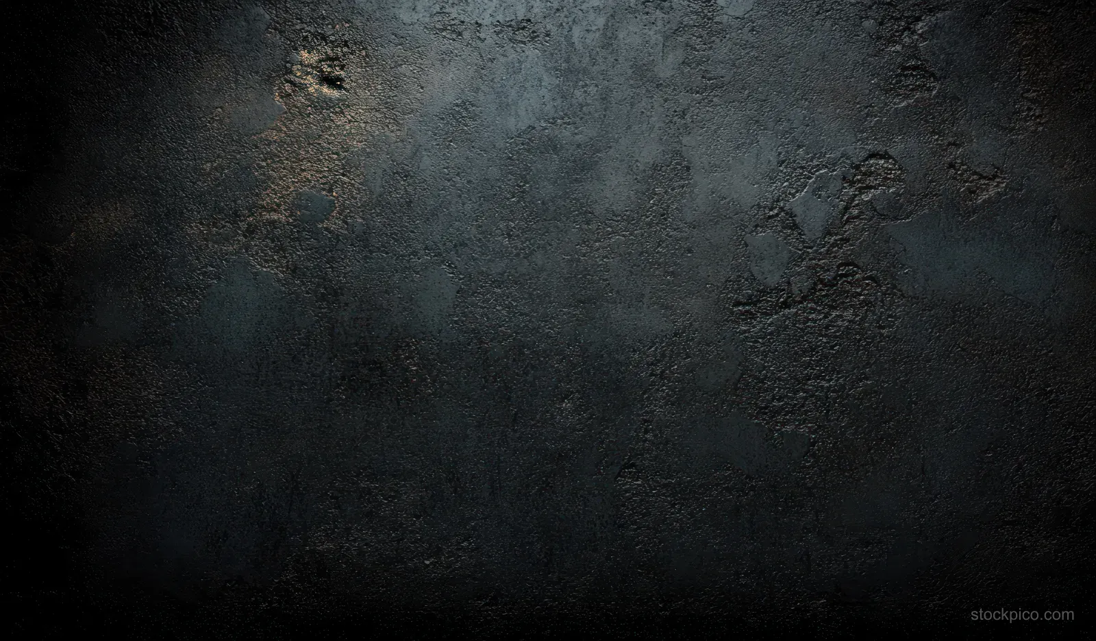 Close-up of a dark concrete wall texture with grunge stains, cracks, and soft ambient lighting.
