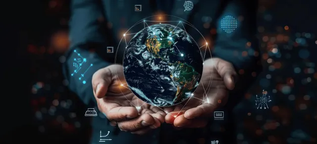 Hands holding a glowing digital Earth with network icons on a dark background.