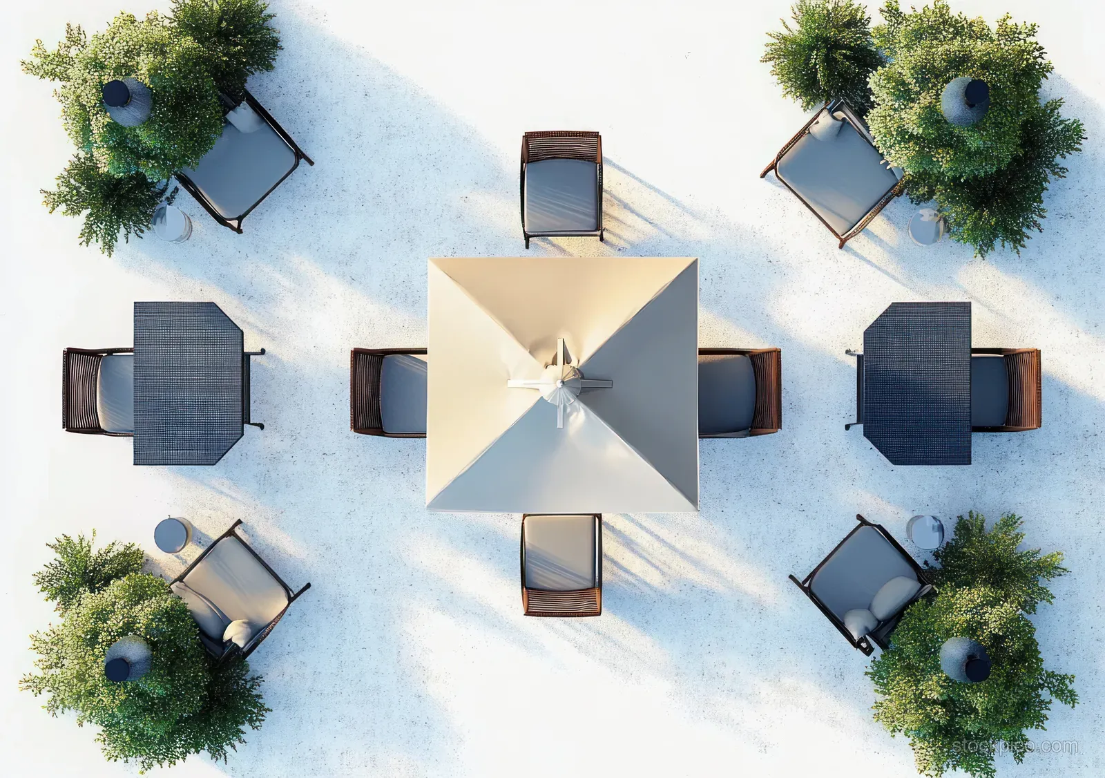 Overhead view of square outdoor tables and chairs around a large beige umbrella with potted green plants on a white surface.