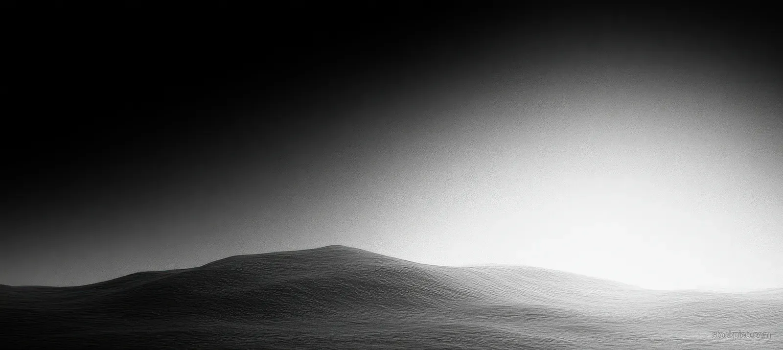 Grayscale abstract hills beneath a soft light gradient with subtle film grain texture.