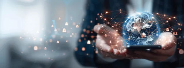 Hands using a smartphone with glowing Earth network, AI data streams and social icons