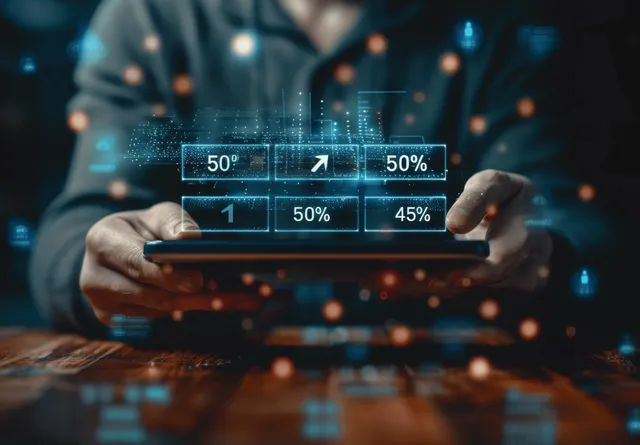 Businessman holding tablet showing digital network analytics over global shopping icons