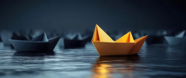Golden paper boat leads a dark origami fleet across a glossy reflective surface