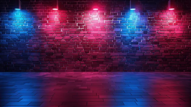 Neon red and blue glow washes a brick wall at night with dark empty floor