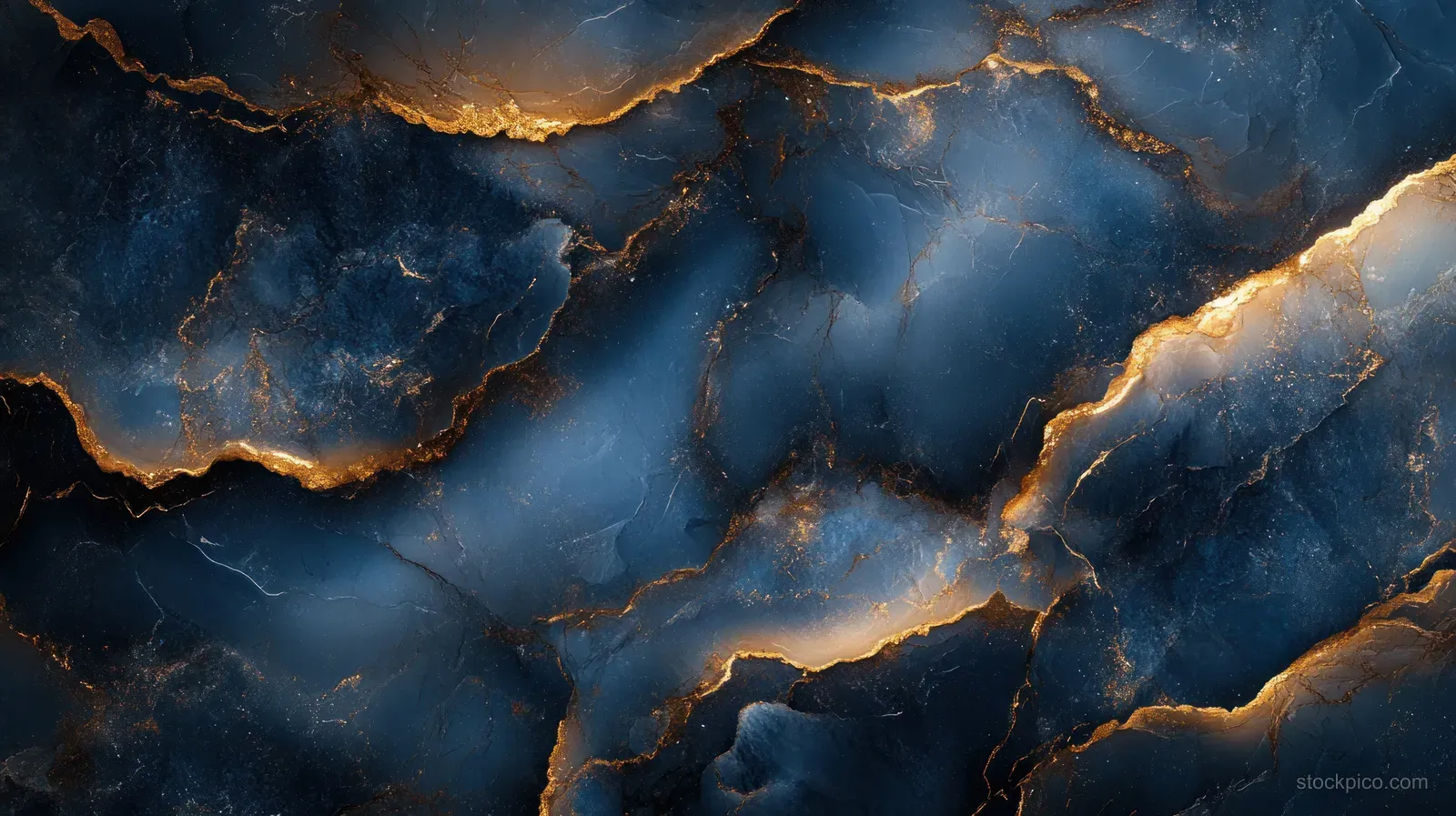 Blue marble texture with luminous gold veins forming fractured patterns across the stone surface.