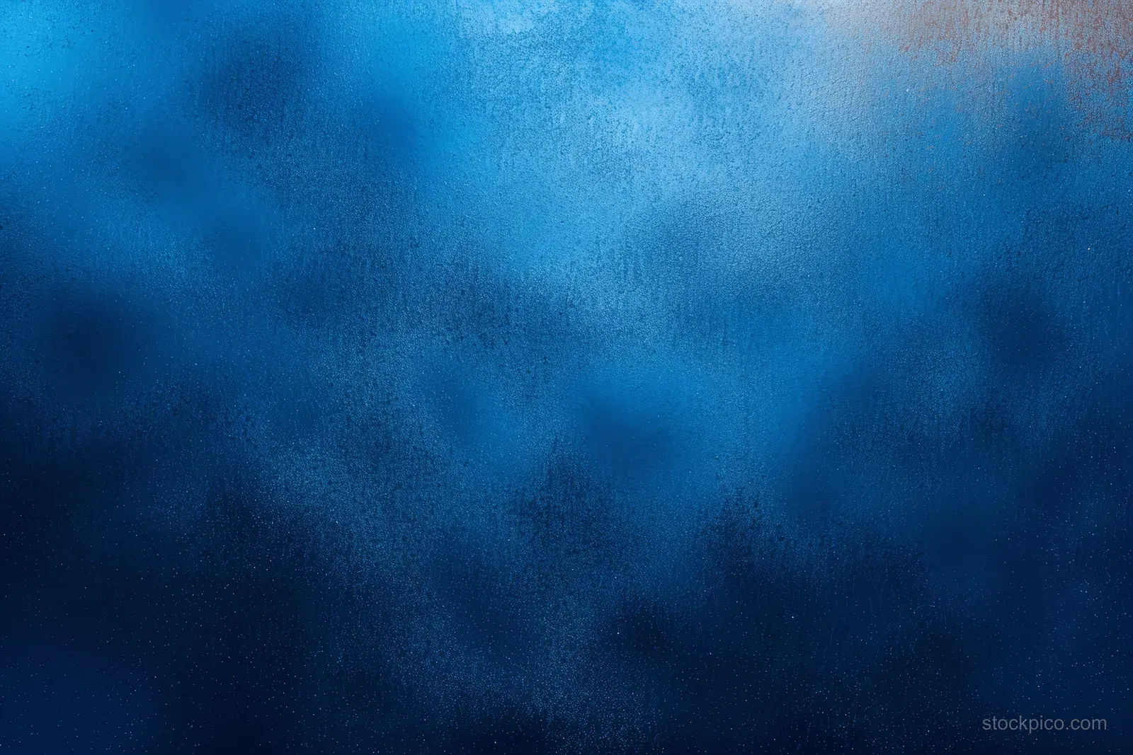 Blue abstract background with a grainy texture and soft gradient shapes.