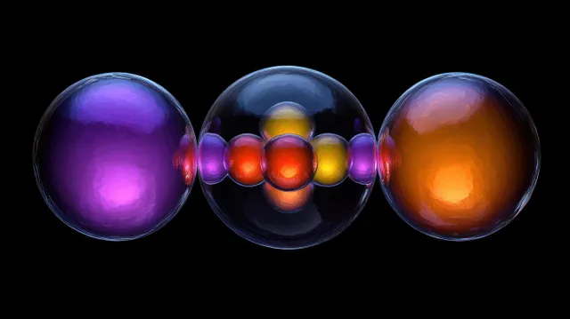 Three translucent spheres with nested glowing orbs on black background