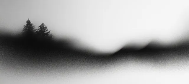 A monochrome misty landscape silhouette blurred into a soft gray background with subtle grain.