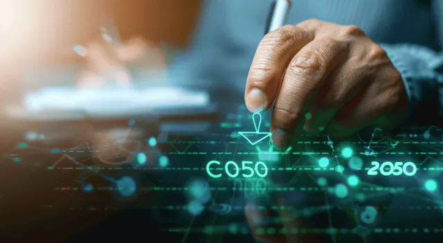 Hand selecting CO2 reduction target on glowing climate dashboard
