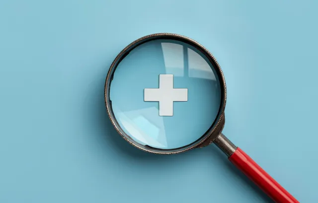 Magnifying glass highlighting a plus medical symbol on blue background with crisp 3D detail