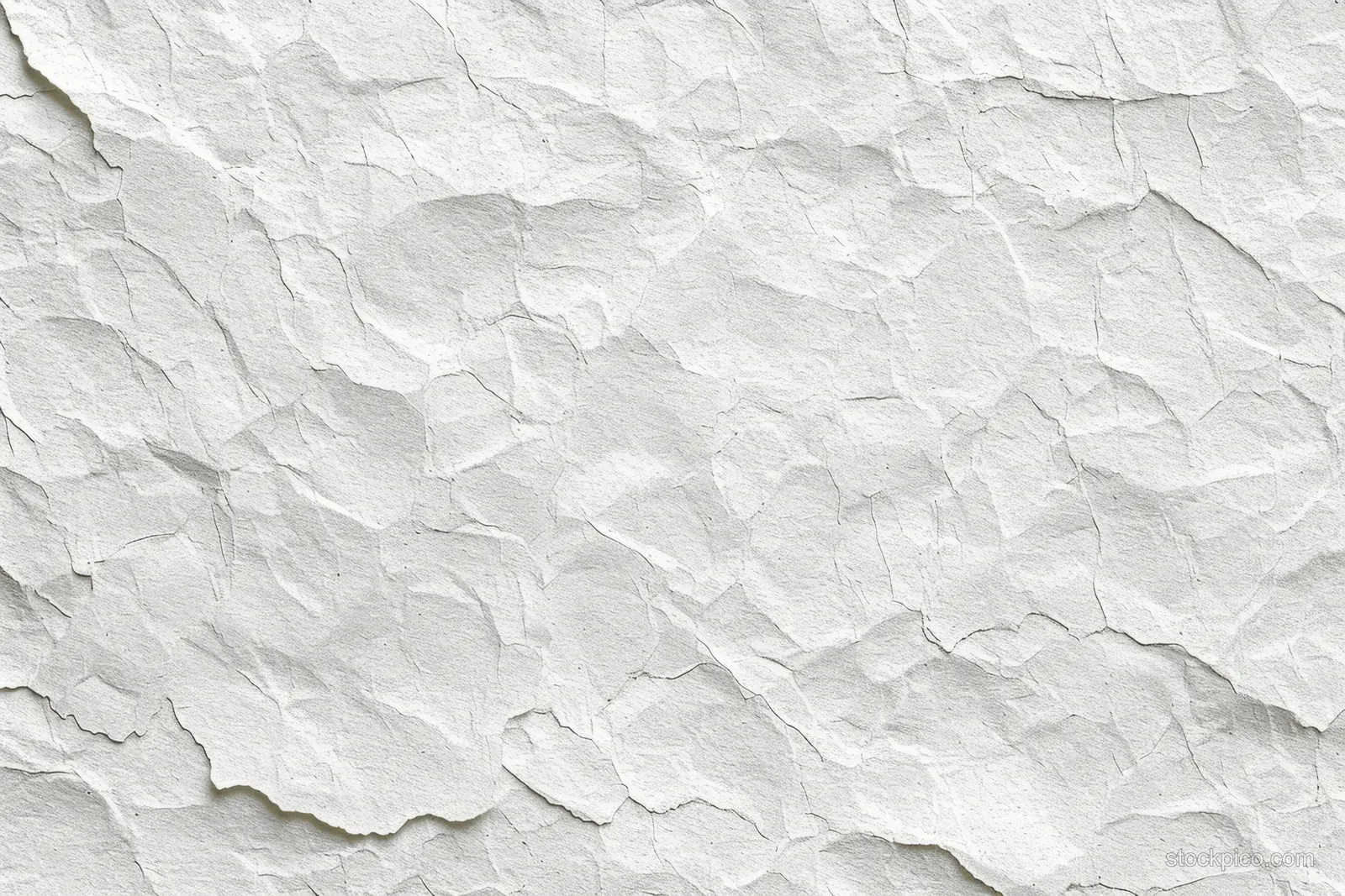 Crumpled white paper texture fills the frame with visible folds and subtle watercolor grain.