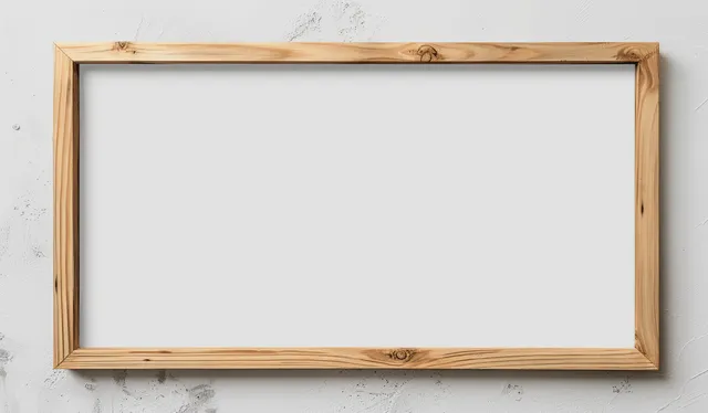 A horizontal wooden picture frame sits on a white textured wall with an empty inner area and soft shadows.