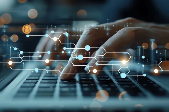 Hands using a tablet with glowing flowchart node connections over a digital workflow interface.