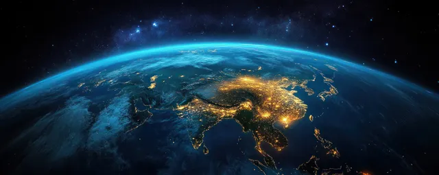 Earth from space at night with glowing city lights across Asia and a curved blue atmospheric rim under stars.
