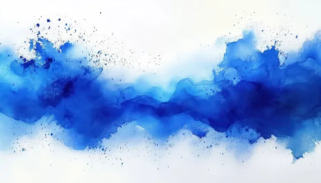 Blue watercolor splash forms a horizontal wash with ink speckles and soft dripped edges on textured paper.