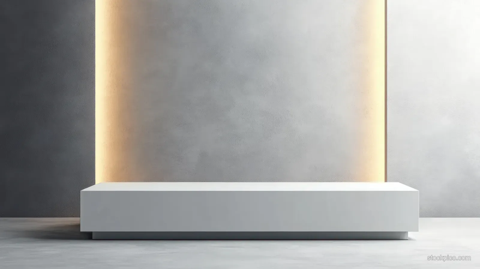 White exhibition counter placed on a spotlight-lit stage with an empty front panel for display branding.